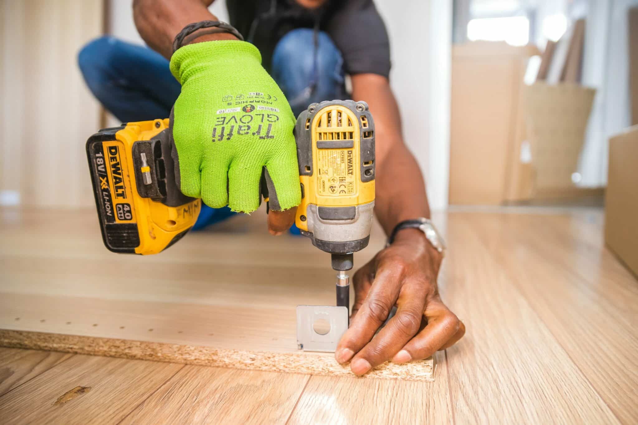 Image of hand person drilling doing some construction work